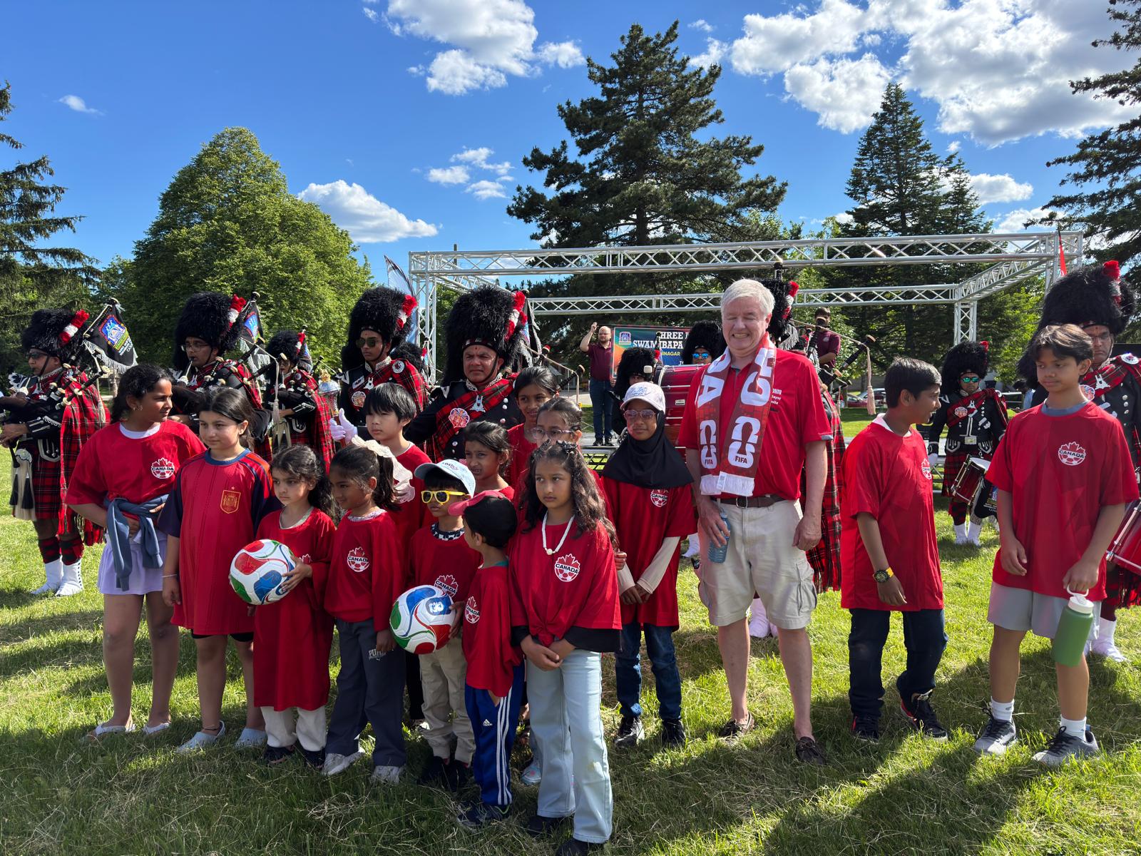 Children and community guests gathered with performers at FIFA Fan Fest 2026